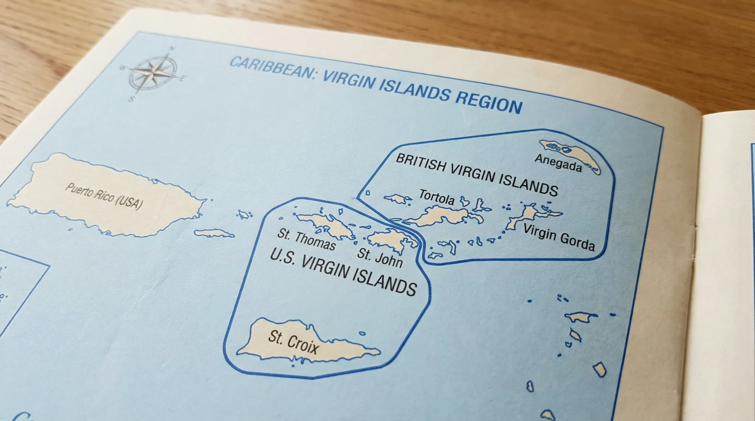A simple Caribbean map highlighting the Virgin Islands region with two labeled clusters: British Virgin Islands (Tortola, Virgin Gorda, Anegada) and U.S. Virgin Islands (St. Thomas, St. John, St. Croix), with light blue sea and minimal surrounding islands for context.