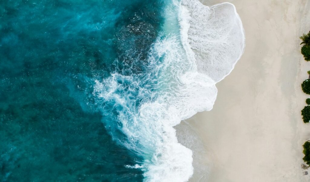 Luxury motor yacht underway on calm open water at golden hour