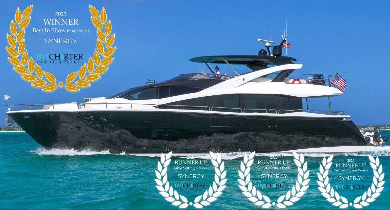 Motor yacht SYNERGY sailing on turquoise water with gold laurel wreaths announcing 2023 Best In Show winner and three runner-up awards across categories.