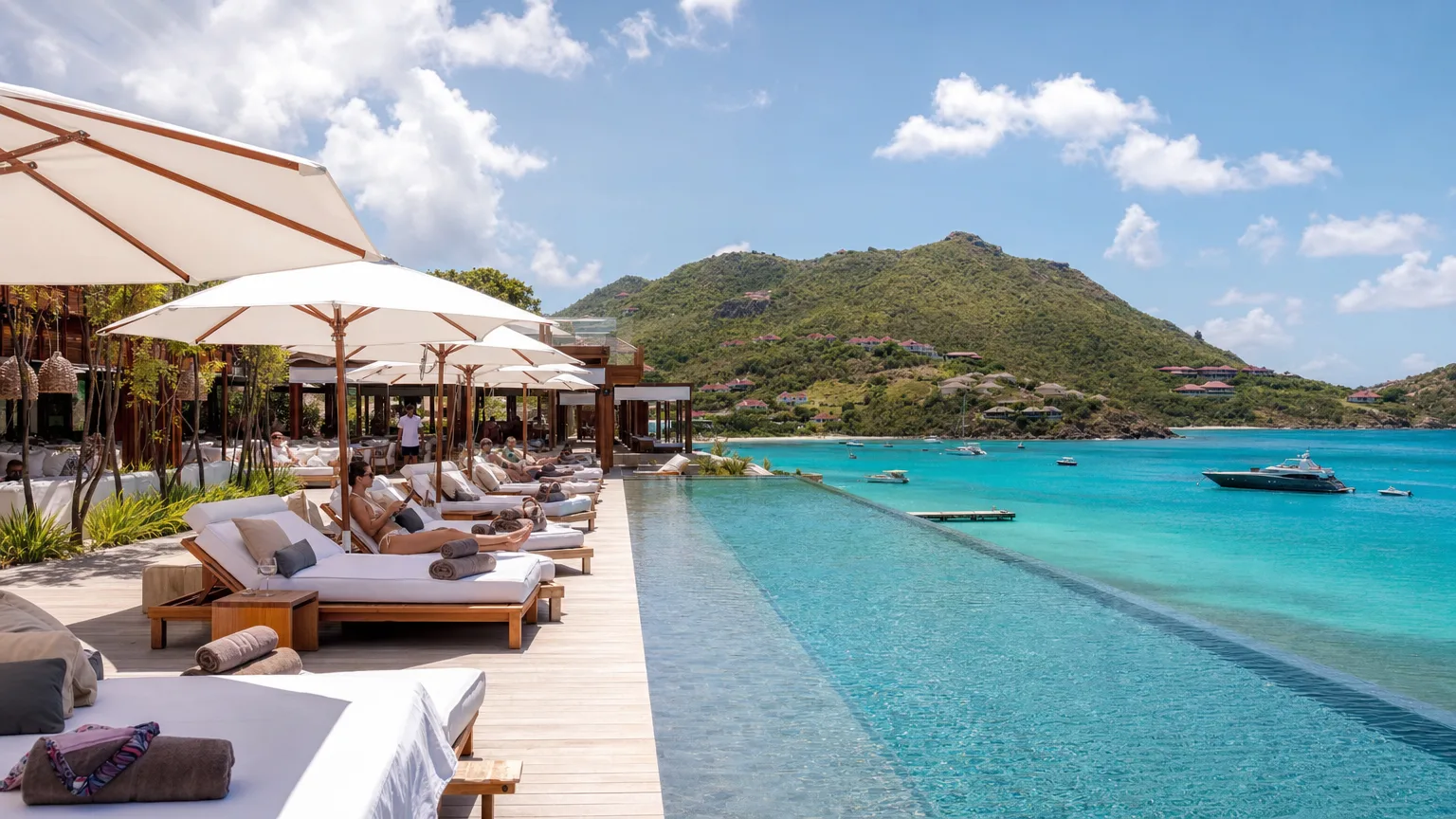 featured-image-12 | Vital Charters Chic private-island infinity pool spilling toward the turquoise ocean at a US Virgin Islands beach club