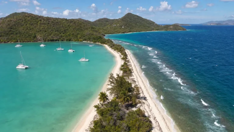 Aerial view of the narrow sand isthmus at Salt Whistle Bay, Mayreau, between the Caribbean and the Atlantic