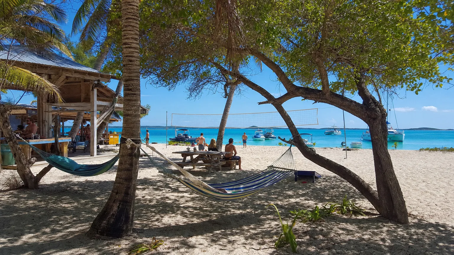 featured-image-5 | Vital Charters Barefoot beach bar on Stocking Island with boats anchored in turquoise Elizabeth Harbour, Exumas