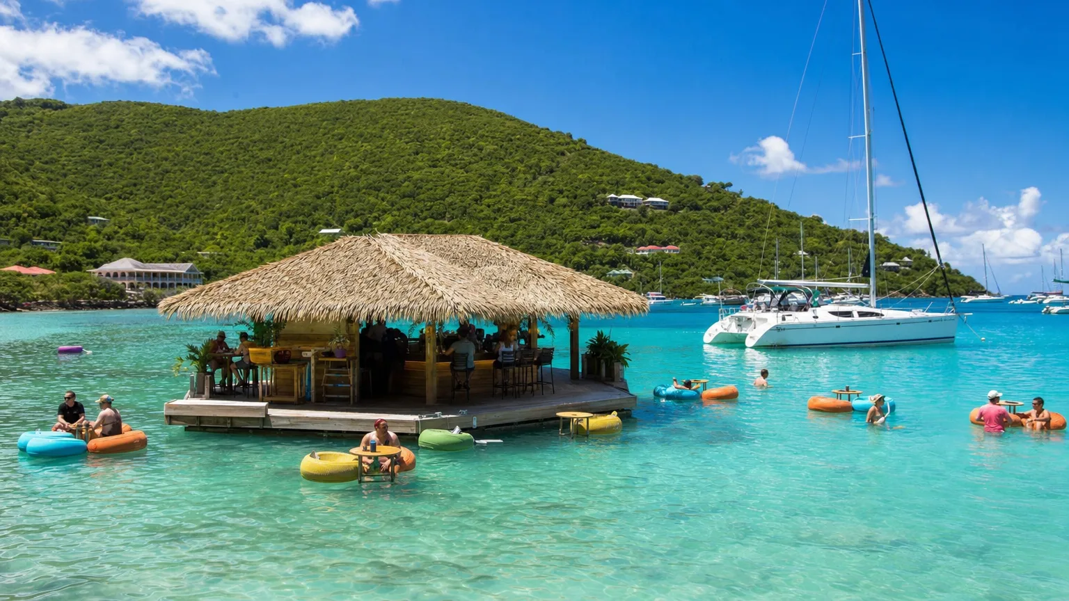 Floating taco bar with lily-pad seats in a turquoise US Virgin Islands bay, reached only by boat