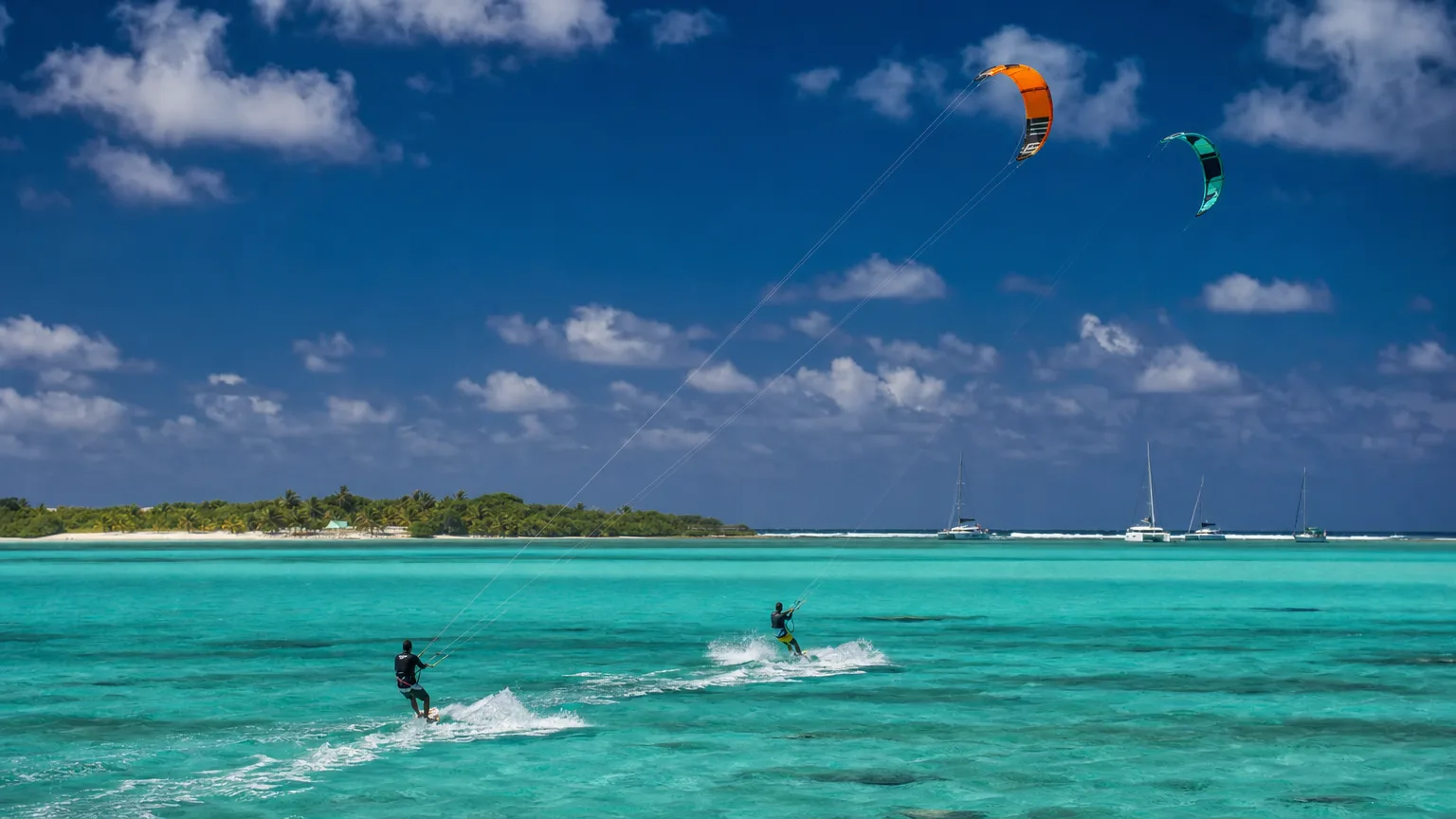 Kitesurfers on the reef-protected flats off Union Island, Grenadines
