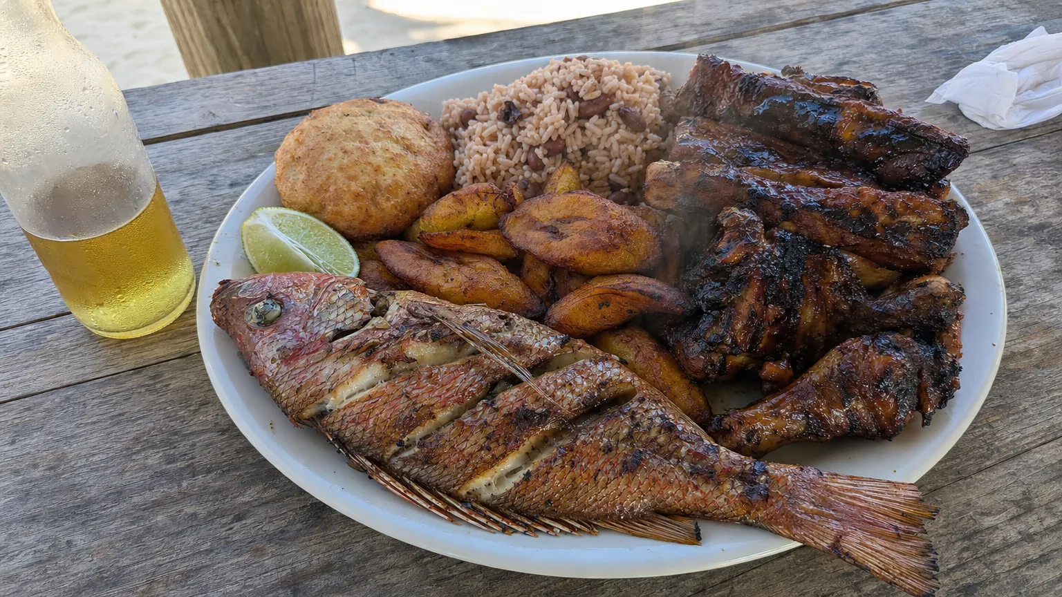 Creole barbecue plate with grilled snapper ribs and rice at a Grand Case lolo