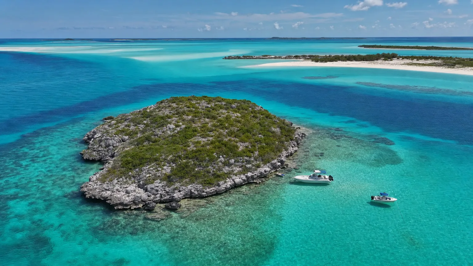 The Thunderball Grotto limestone cave islet rising from turquoise water off Staniel Cay, Exumas