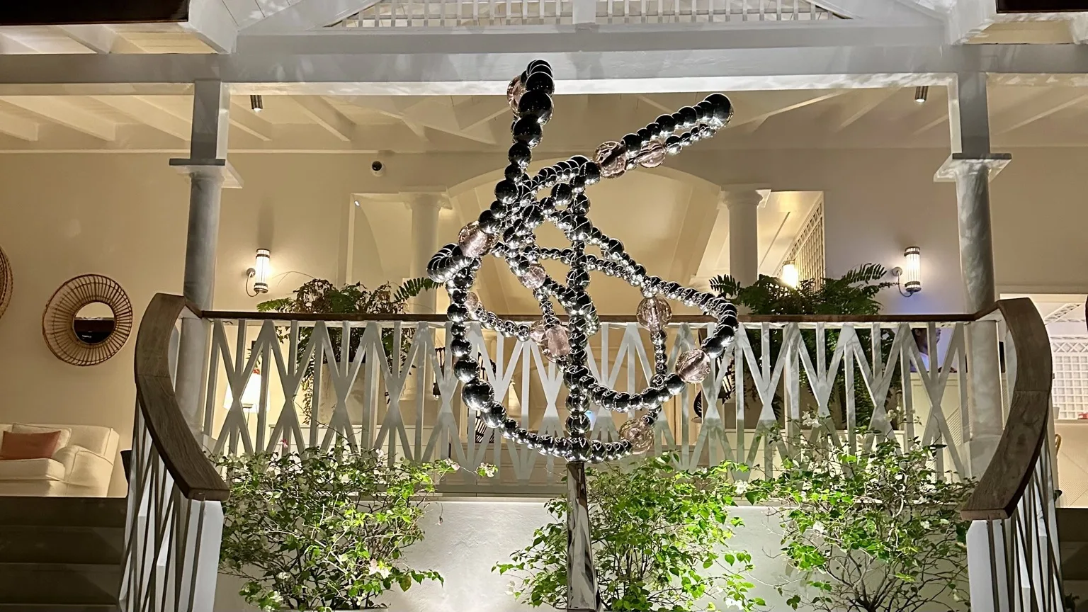 Glass bead sculpture lit at night in the open-air lobby at Cheval Blanc St-Barth
