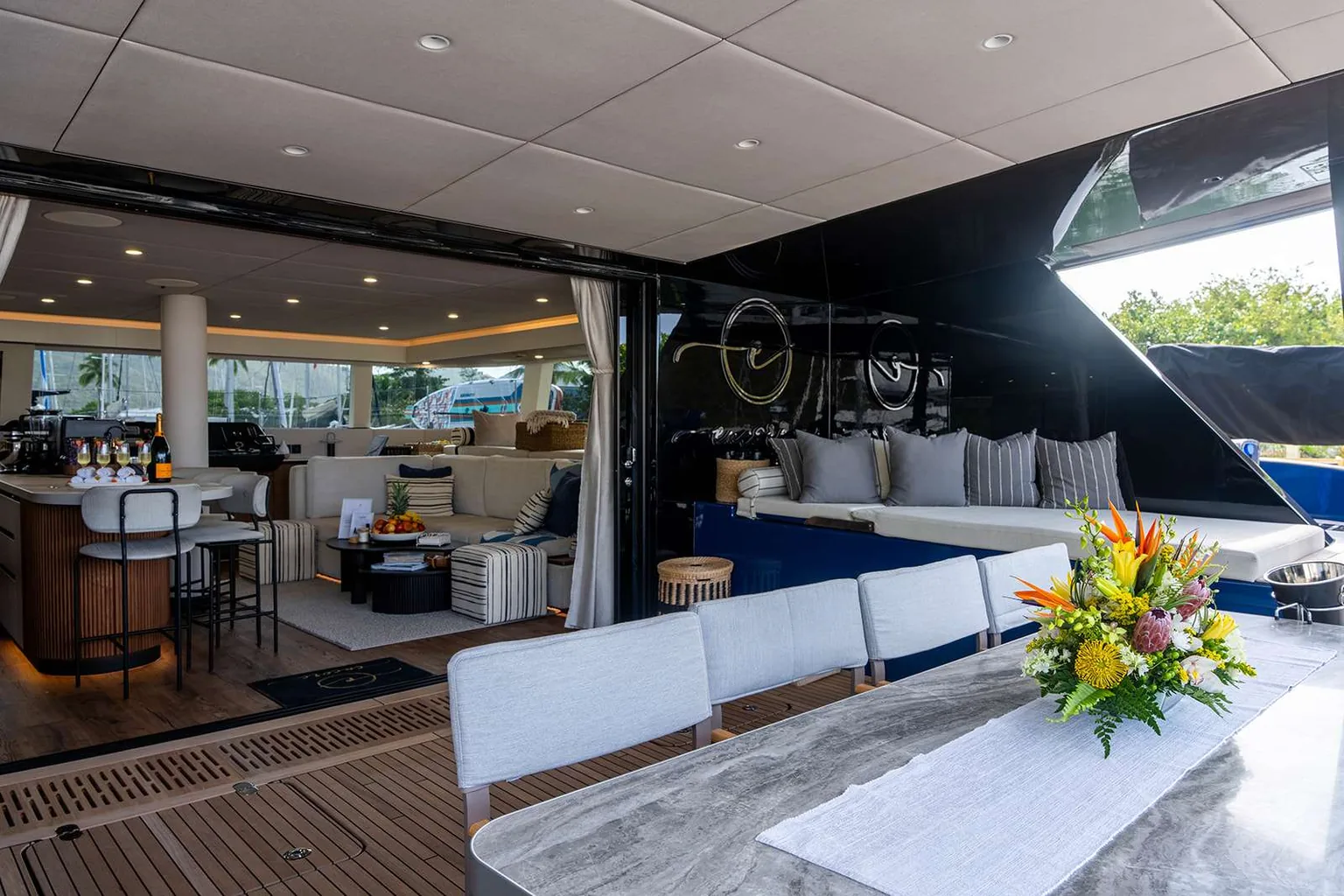 Aft cockpit dining table and main saloon aboard the Sunreef 60 Encore