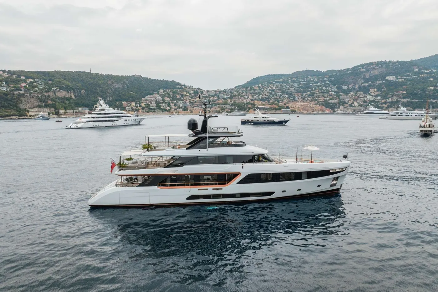 Delivered in 2023, ALLURIA&rsquo;s contemporary interior, light-flooded rooms, and modern features are inspired by the glamorous Motopanfilo yachts built over 50 years ago. Accommodating 10 overnight guests in five cabins, she has a multitude of communal spaces and amenities to appeal to a mixed charter group or families alike.

One of her many highlights is the &rsquo;cocoon-style&rsquo; observation deck that provides an intimate space to enjoy a morning coffee or evening sundowner while taking in sweeping views. The spacious Hamptons-style beach club invites guests to relax in the sun at sea-level and features a retractable fabric canopy providing ample shade when needed; as well as a platform for easy access when enjoying one of the yacht&rsquo;s broad selection of water toys. Her foredeck outdoor pool lounge is yet another exterior space to soak up the sun, with plush sun pads and a large swimming pool.

ALLURIA&rsquo;s floor-to-ceiling windows, clever use of mirrors, and open-plan interior create an environment that is bright, sophisticated, and connected with the surrounding ocean. The main salon features wide-spanning windows, allowing guests to take in the incredible panoramic views even indoors, socializing on her comfortable sofa, sipping a cocktail by the cylindrical bar cabinet or enjoying a sunset dinner in her formal dining area. She provides seamless flow from the interior main salon to the main deck aft. Each of the cabins are well-appointed. The vast full-beam, on deck master suite is designed with natural light from the surrounding panoramic windows. It also features a private seating space that can be used as an office, a vanity and a generous en suite bathroom. Her four additional guest cabins are well-appointed and ideal for families, mixed groups and couples.