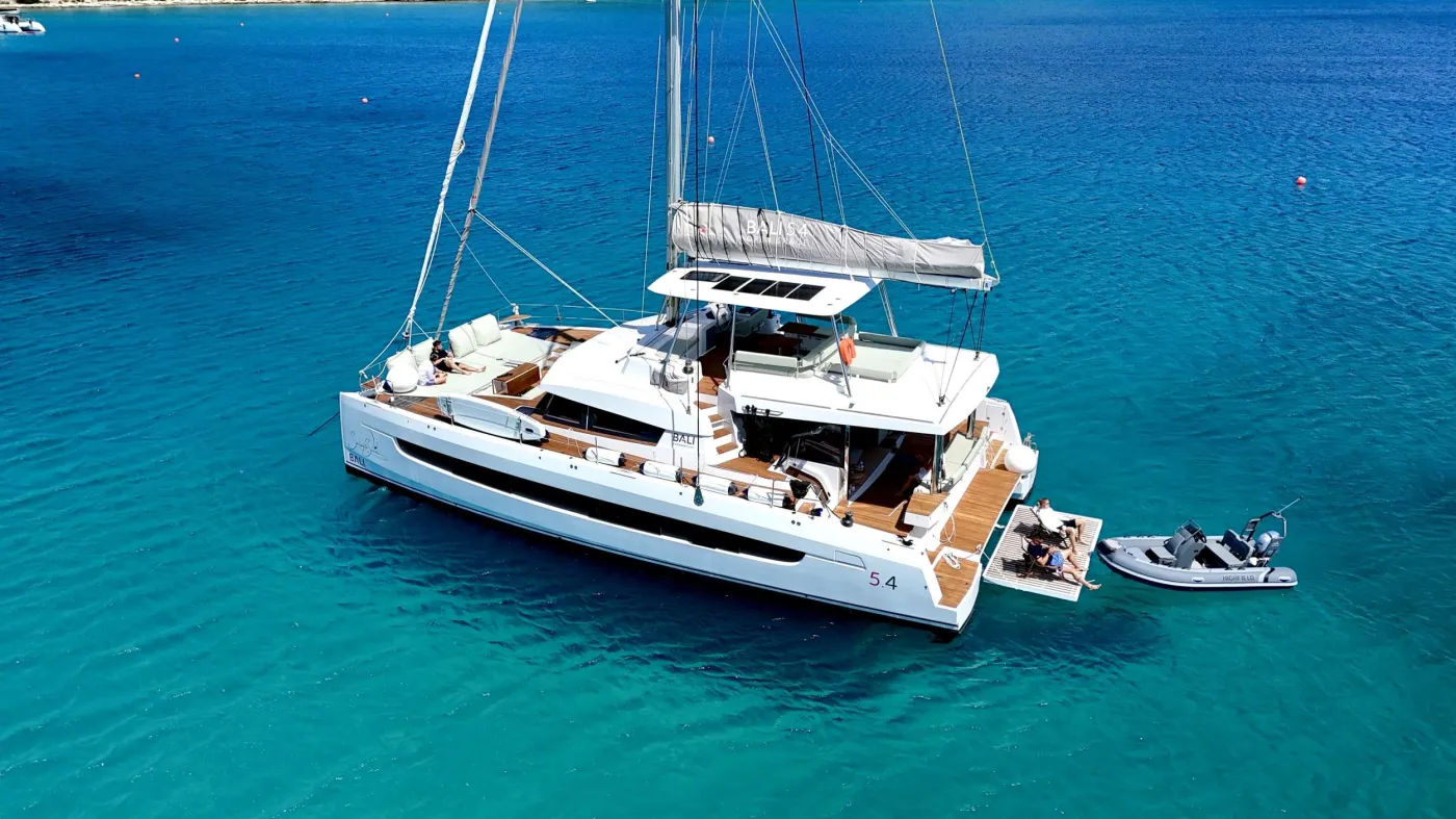 MASTERMIND II is a stunning new 2024 Bali 5.4 positioned for both Mediterranean and Caribbean seasons. This modern catamaran perfectly combines comfort, flexibility, and adventure.
MASTERMIND II accommodates up to 10 guests across 5 thoughtfully designed cabins: 2 queen cabins with dry heads, 2 double cabins with wet heads, and 1 twin cabin with a dry head. All cabins feature full air-conditioning and en-suite facilities throughout, ensuring comfort for everyone aboard.
The clean, flexible layout makes her ideal for both families and mixed groups. Following Bali's signature open-plan concept, MASTERMIND II connects the salon, aft cockpit, and forward lounging areas into one continuous living space perfect for entertaining or unwinding.
Whether you're seeking adventure or relaxation, she's fully equipped. Our water toys collection includes a 50 HP tender (accommodating up to 8 guests), sea scooters, wakeboards, stand-up paddleboards, towable tubes, floating mats, and complete snorkel gear.
From Mediterranean island-hopping to Caribbean exploration, MASTERMIND II is ready for your next charter.