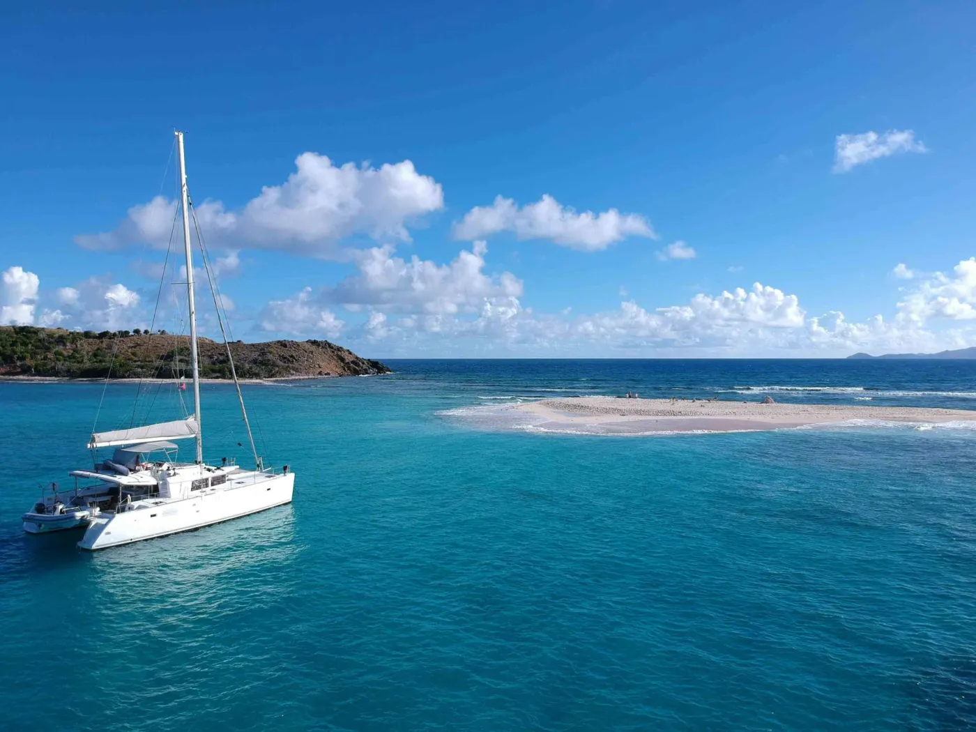 Gypsy Princess is a fabulous 2012 award-winning 45' Lagoon catamaran that offers the ultimate in luxury and comfort. Her three queen guest cabins each have their own private ensuite head with separate shower stall, full air conditioning, and the most luxurious French linens available.
On deck, you'll find a spacious flybridge with seating and a padded sundeck, as well as a foredeck cockpit that's perfect for sunset cocktails. Whether you're looking to relax and unwind or explore the Caribbean in style, Gypsy Princess is the perfect charter yacht for you.