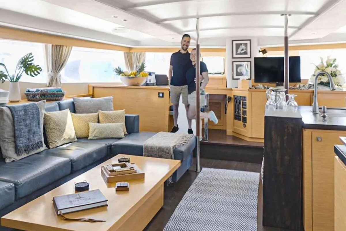 Odyssea is a beautiful 59' Fontaine Pajot chartering the BVI in the Caribbean.
Guests can relax in her spacious salon and enjoy watching all the delicious meals being prepared in the up galley. Dining on the aft deck offers alfresco dinging and relaxing on the sun-bed watching the sun set. Since we offer a wet bar, a cold beverage is never too far away; whether you are floating on the inflatable island, going for a sundowner cruise in our 15' tender or merely lying on the nets under the stars. A large sky lounge on salon roof where guests can enjoy sun bathing is a favourite spot to enjoy happy hour treats and some of the Captain's delicious cocktails all the while enjoying a 360° view and a soft sea breeze.
Come and join us in the British Virgin Islands onboard Odyssea!