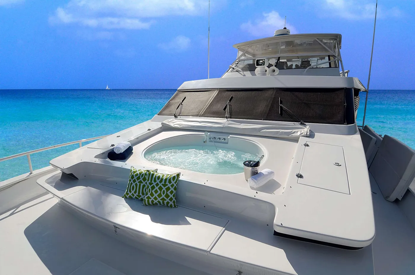 Welcome aboard SUITE LIFE, your private ALL-INCLUSIVE 92’ x 22’ (3,000 sq ft) floating luxury resort.
She is annually refitted and updated by her Owner/Operators and will be entering her 10th season as a treasured charter yacht in the US and British Virgin Islands. Suite Life has 4 staterooms, 5 baths, plus separate crew quarters, and accommodates up to 9 guests in air conditioned luxury. Her spacious layout offers 2 bars, 3 dining areas, a day head and an expansive salon for comfortable seating and movies on-demand via STARLINK.
Gaze at a new sunrise every morning while you workout on the BowFlex elliptical or sip coffee in the aft alfresco teak dining area. Bask the day away relaxing on the upper deck lounges, over-sized bow sun pad, or if you prefer, snorkeling right off the expansive swim platform. End the day, toasting with champagne in the sunken bow hot tub.
Suite Life’s luxury staterooms are all appointed with percale sheets, Egyptian cotton towels and robes to provide ultra comfort during guests private yacht charter. The Master Silver Palm Suite has a King bed, walk-in closet, security box, vanity table, sofa and master bathroom with full jacuzzi.The VIP Bay Rum Suite has a walk-around queen and walk-in closet. The port side Spice Berry Suite guest stateroom has a queen bed and large closet. The starboard Wild Coral Suite guest stateroom has a full bed and twin.
All staterooms have marbled en-suite bathrooms with enclosed showers. Each bedroom also has its own “smart” flat-screen televisions, with STARLINK access, Bluetooth stereos and individual climate control, air conditioned 24/7.
Suite Life’s locally based, seasoned professional, friendly and knowledgeable crew of three will show you the secret hidden treasures of the Virgin Islands few know about. We ensure our guests vacation is effortless, so sit back, relax and live the Suite Life.
Note: Suite Life M/Y has both a U.S. and British Virgin Island Business license so it is able to operate across all of these 60+ Islands and Cays.