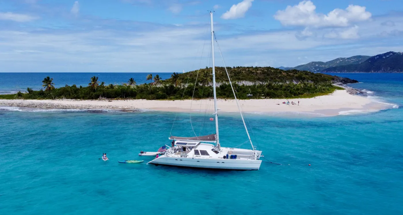 Ad Astra is a very special boat. She was built as a true Bluewater yacht. As such, she is faster, stronger, and far more stable than almost all the competition in the BVI charter fleets. Featuring 4 cabins, 3 with queen sized beds and TVs and one with two single bunk beds, she offers great flexibility for families. All cabins have private bathrooms, showers, electric toilets, and hot and cold water. The salon and fully covered cockpit are spacious and comfortable with loads of space for relaxing, entertaining, and dining. The two sun/shade beds in the cockpit and massive trampolines forward will cater to any sun lover. 4 separate air conditioners/heaters and excellent ventilation will keep you comfortable in any weather. Additionally, Ad Astra’s 270-gallon water tanks, 2 water heaters and a 48 gallon per hour fresh water maker means there is plenty of water for everyone. There are even 2 separate drinking water taps filtered to 5 microns so there is no need to keep buying bottled water! Her fully equipped galley including very larger refrigerator and freezer, 3 burner range, convection oven, microwave, 2 dishwashers (yes 2), ice maker, and even a garbage disposal make cooking a joy and clean up a breeze. At night the beautiful underwater lights bring tons of sea life to the boat. It’s like having an aquarium all around you. Most importantly, Ad Astra is a sailor’s boat. She is an absolute blast to sail. Twin helms and exceptionally responsive steering will keep a smile on the face of whoever is helming.
