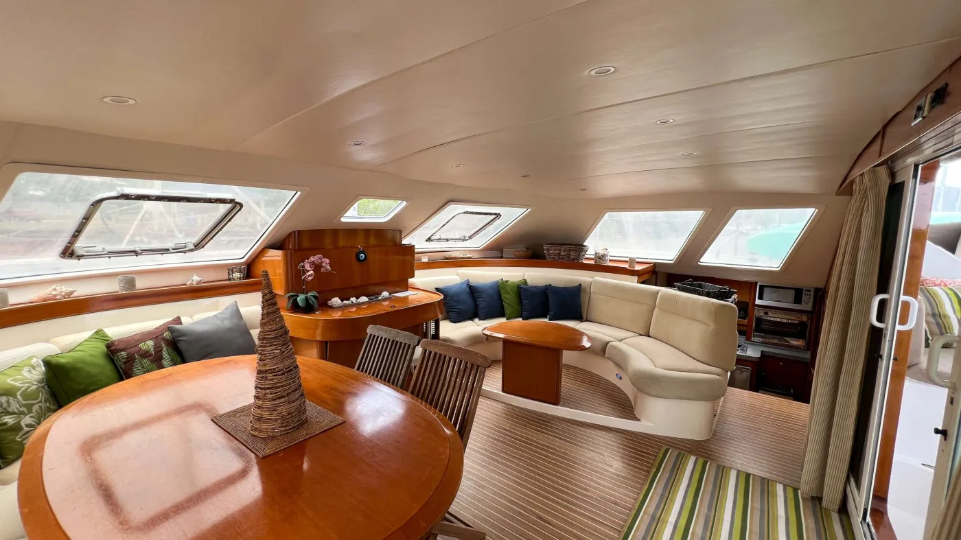 Ad Astra is a very special boat. She was built as a true Bluewater yacht. As such, she is faster, stronger, and far more stable than almost all the competition in the BVI charter fleets. Featuring 4 cabins, 3 with queen sized beds and TVs and one with two single bunk beds, she offers great flexibility for families. All cabins have private bathrooms, showers, electric toilets, and hot and cold water. The salon and fully covered cockpit are spacious and comfortable with loads of space for relaxing, entertaining, and dining. The two sun/shade beds in the cockpit and massive trampolines forward will cater to any sun lover. 4 separate air conditioners/heaters and excellent ventilation will keep you comfortable in any weather. Additionally, Ad Astra’s 270-gallon water tanks, 2 water heaters and a 48 gallon per hour fresh water maker means there is plenty of water for everyone. There are even 2 separate drinking water taps filtered to 5 microns so there is no need to keep buying bottled water! Her fully equipped galley including very larger refrigerator and freezer, 3 burner range, convection oven, microwave, 2 dishwashers (yes 2), ice maker, and even a garbage disposal make cooking a joy and clean up a breeze. At night the beautiful underwater lights bring tons of sea life to the boat. It’s like having an aquarium all around you. Most importantly, Ad Astra is a sailor’s boat. She is an absolute blast to sail. Twin helms and exceptionally responsive steering will keep a smile on the face of whoever is helming.