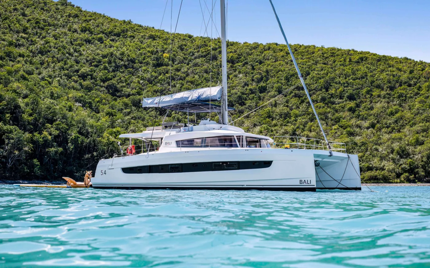 PERMABEAR is a 2023 Bali sailing catamaran built for big groups who want bright spaces, easy flow, and nonstop ocean views. Step into the teak-floored cockpit with dining for 10 and a plush lounge bench&mdash;made for long meals and lazy afternoons at anchor. Up top, the expansive flybridge delivers panoramic 360&deg; views, up-close sail watching, sundowners, and the best breeze onboard. Inside, the salon is airy and modern with wraparound windows that flood the space with natural light. Sleeps up to 10 in 5 cabins: 3 Queen cabins plus 2 Twin cabins&mdash;each with a private ensuite. With multiple social zones to gather or spread out, PERMABEAR keeps everyone comfortable, connected, and smiling. Spacious, sunlit, and seriously fun&mdash;PERMABEAR is the kind of charter you&rsquo;ll talk about all year.