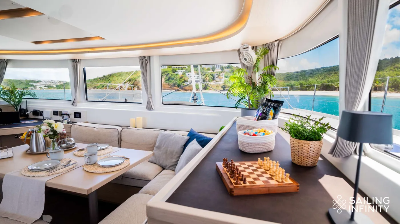 Step onboard into a world of pure opulence with the brand-new 2023 Lagoon 46 owners version, Infinity! This fully equipped, sailing catamaran is the epitome of sophistication and comfort boasting one incredibly spacious master cabin suite and two double cabins with queen sized beds and three en-suite bathrooms for guests to use. 

Infinity boasts an extensive list of water toys onboard which will be sure to elevate your Caribbean charter vacation experience to unparalleled heights of adventure! Soak up the Caribbean sun up top on the flybridge, lounge in the comfortable foredeck seating area or enjoy delicious meal times together in Infinity's aftdeck dining area which also doubles up as a great space for out-door movie nights via Infinity's projector screen!

Sail into the most enchanting bays aboard Infinity where the waters glisten in shades of crystal blue, and the shores boast powdery white sands. This is your gateway to all the wonders the Caribbean has to offer. Unleash your sense of adventure, bask in the serenity of secluded coves, and let Infinity and her crew craft unforgettable memories for you and your charter group 