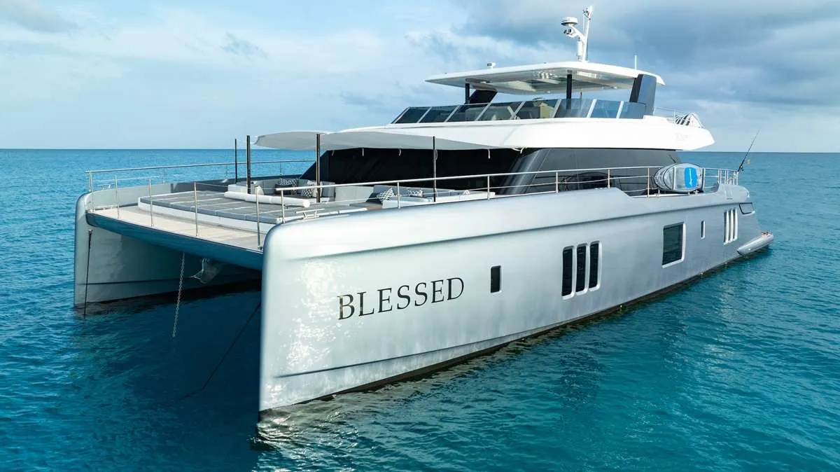 Welcome aboard BLESSED, the newest and most State-of-the-Art 2024 Sunreef 80 available for charter. This luxurious yacht has been thoughtfully constructed by owners who have spent 20 years exploring the Virgin Islands. They were gathering inspiration in order to build the ultimate charter experience. Even the name, BLESSED, reflects the inner joy and peace often shared by the local Virgin Islanders. It is a common saying throughout the Islands, "Have a BLESSED Day." The yacht's mission is to provide their guests with a serene and unforgettable journey, which is reflected in her name.
BLESSED offers a spacious and luxurious feel normally only found aboard Motor Yachts of the 130’ range. The open main salon, with galley up layout, creates a friendly and inviting atmosphere. Perfect for relaxing and socializing. The aft deck, with seating for up to 10, is ideal for memorable alfresco dining and conversation. It is complimented with an ice maker, 2 refrigerators and chilled filtered water for your convenience.
The expansive flybridge is one of the most popular areas on BLESSED. It features 2 refrigerators, 2 ice makers, a wet bar and a 55” smart TV. With multiple locations for sunbathing or enjoying the shade, this space is designed for ultimate relaxation (and the occasional dance party)! It is also the ideal spot for taking in the spectacular underway views. The jacuzzi will bubble away any remaining cares that you may have.
Four of the guest cabins are accessed through the main salon. Each one has a European King Bed and are equally appointed with the finest, most comfortable bedding. The en-suite bathrooms boast the most elegant rain showers imaginable. The Fifth Guest Cabin is accessed from the port aft deck. It is appointed with a double bed and an en-suite bath with rain shower.
Water sports are a significant part of the BLESSED experience. The Yacht’s Toy Garage easily deploys into the water, providing effortless access to exciting adventures with the eFoil’s or SeaBobs! The hydraulic platform also lowers, getting you close to the Water’s Sky Blue Edge. Relax on a lounger or slip in for a snorkel. Or, enjoy a refreshing cocktail on the 10’ inflatable pool deck. Casual SCUBA diving is always an exciting option.
Join us on BLESSED for an unforgettable rejuvenating experience. Whether you seek relaxation, adventure, or simply a moment of inner peace, this yacht is your gateway to unwinding in your own special way.