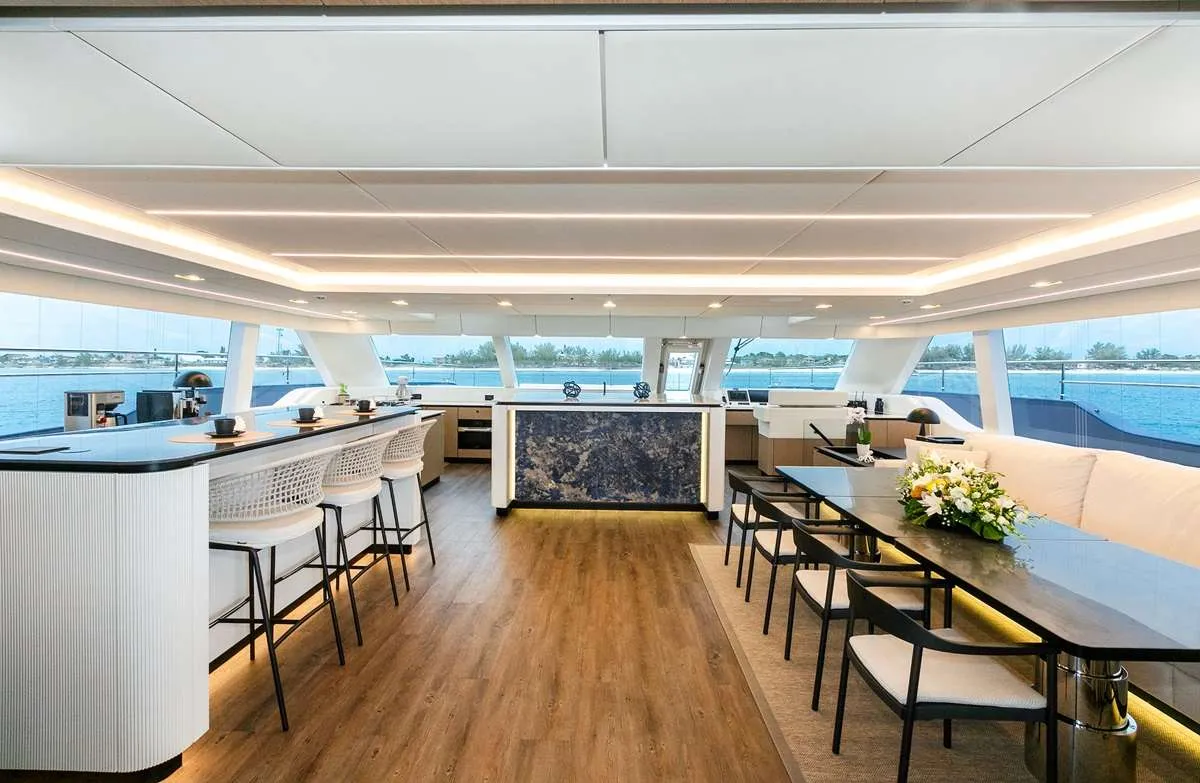 Welcome aboard BLESSED, the newest and most State-of-the-Art 2024 Sunreef 80 available for charter. This luxurious yacht has been thoughtfully constructed by owners who have spent 20 years exploring the Virgin Islands. They were gathering inspiration in order to build the ultimate charter experience. Even the name, BLESSED, reflects the inner joy and peace often shared by the local Virgin Islanders. It is a common saying throughout the Islands, "Have a BLESSED Day." The yacht's mission is to provide their guests with a serene and unforgettable journey, which is reflected in her name.
BLESSED offers a spacious and luxurious feel normally only found aboard Motor Yachts of the 130’ range. The open main salon, with galley up layout, creates a friendly and inviting atmosphere. Perfect for relaxing and socializing. The aft deck, with seating for up to 10, is ideal for memorable alfresco dining and conversation. It is complimented with an ice maker, 2 refrigerators and chilled filtered water for your convenience.
The expansive flybridge is one of the most popular areas on BLESSED. It features 2 refrigerators, 2 ice makers, a wet bar and a 55” smart TV. With multiple locations for sunbathing or enjoying the shade, this space is designed for ultimate relaxation (and the occasional dance party)! It is also the ideal spot for taking in the spectacular underway views. The jacuzzi will bubble away any remaining cares that you may have.
Four of the guest cabins are accessed through the main salon. Each one has a European King Bed and are equally appointed with the finest, most comfortable bedding. The en-suite bathrooms boast the most elegant rain showers imaginable. The Fifth Guest Cabin is accessed from the port aft deck. It is appointed with a double bed and an en-suite bath with rain shower.
Water sports are a significant part of the BLESSED experience. The Yacht’s Toy Garage easily deploys into the water, providing effortless access to exciting adventures with the eFoil’s or SeaBobs! The hydraulic platform also lowers, getting you close to the Water’s Sky Blue Edge. Relax on a lounger or slip in for a snorkel. Or, enjoy a refreshing cocktail on the 10’ inflatable pool deck. Casual SCUBA diving is always an exciting option.
Join us on BLESSED for an unforgettable rejuvenating experience. Whether you seek relaxation, adventure, or simply a moment of inner peace, this yacht is your gateway to unwinding in your own special way.