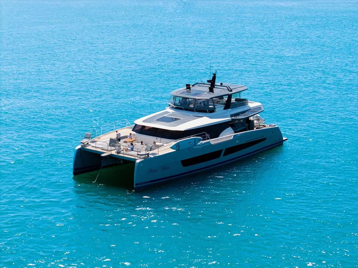 <p>Nana Marie is a 2026 Fontaine Pajot Thira 80 power cat.<br />
Perfect for the Caribbean, the yacht’s outdoor living spaces are exceptional, featuring a massive flybridge and a spacious forward deck that is configured with elegant lounge seating. Enhancing this open‑air experience, the main deck is equipped with fold‑down hydraulic balconies—deployable wings on either side that expand the deck into a sweeping sea‑view terrace.<br />
With the galley down, the salon remains open and spacious, offering plenty of room for both lounging and dining. Below deck, four well‑appointed staterooms comfortably accommodate up to eight guests.</p>