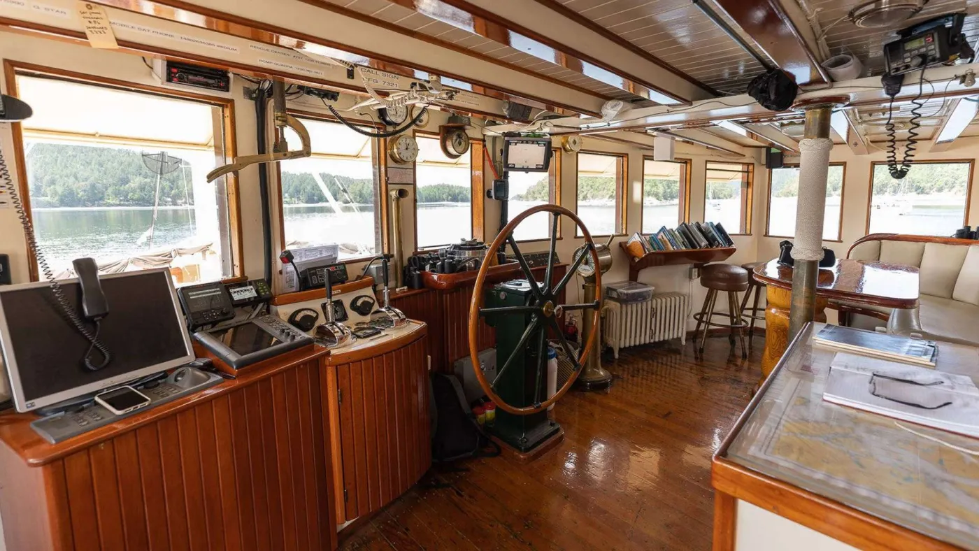 <p>Wheelhouse with view windows and guest seating</p>