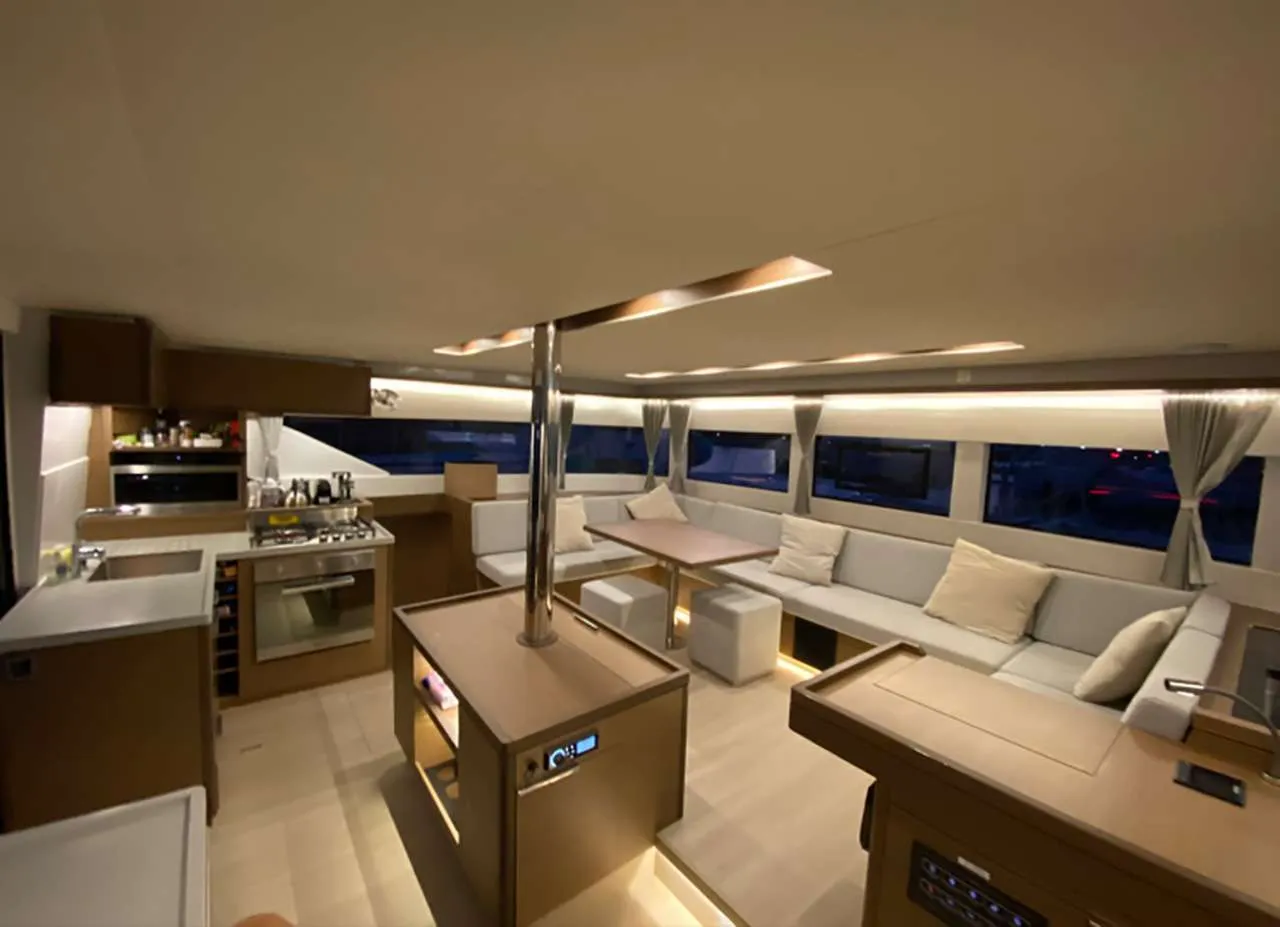 <p>Spacious interior showing salon and galley</p>